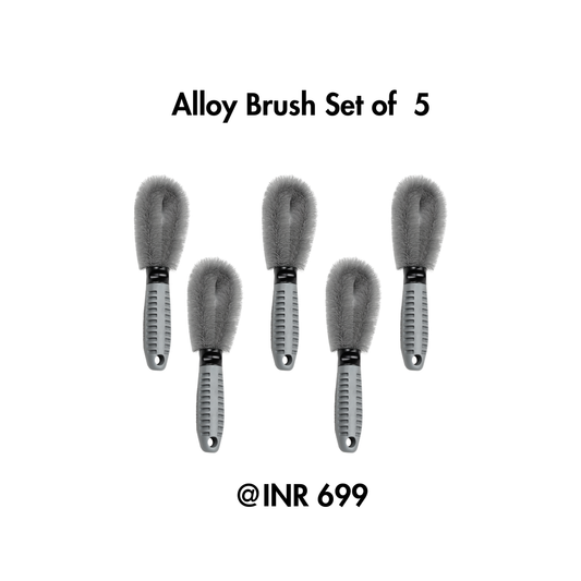 Set of five alloy brushes with a price tag on a white background