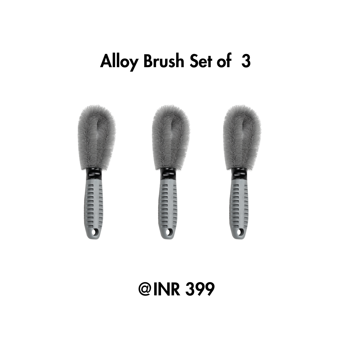 Set of three alloy brushes with gray bristles and black handles on a white background.