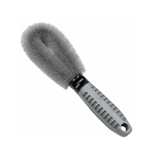 Gray car cleaning brush with a textured handle on a white background