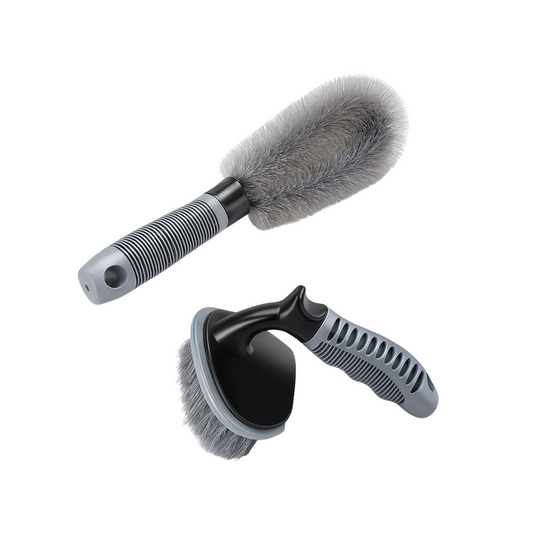 Two car cleaning brushes with gray bristles on a white background