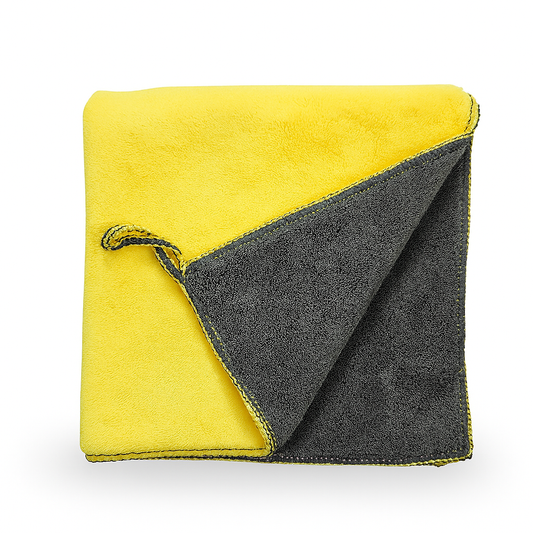 Two-tone yellow and gray towel on a white background