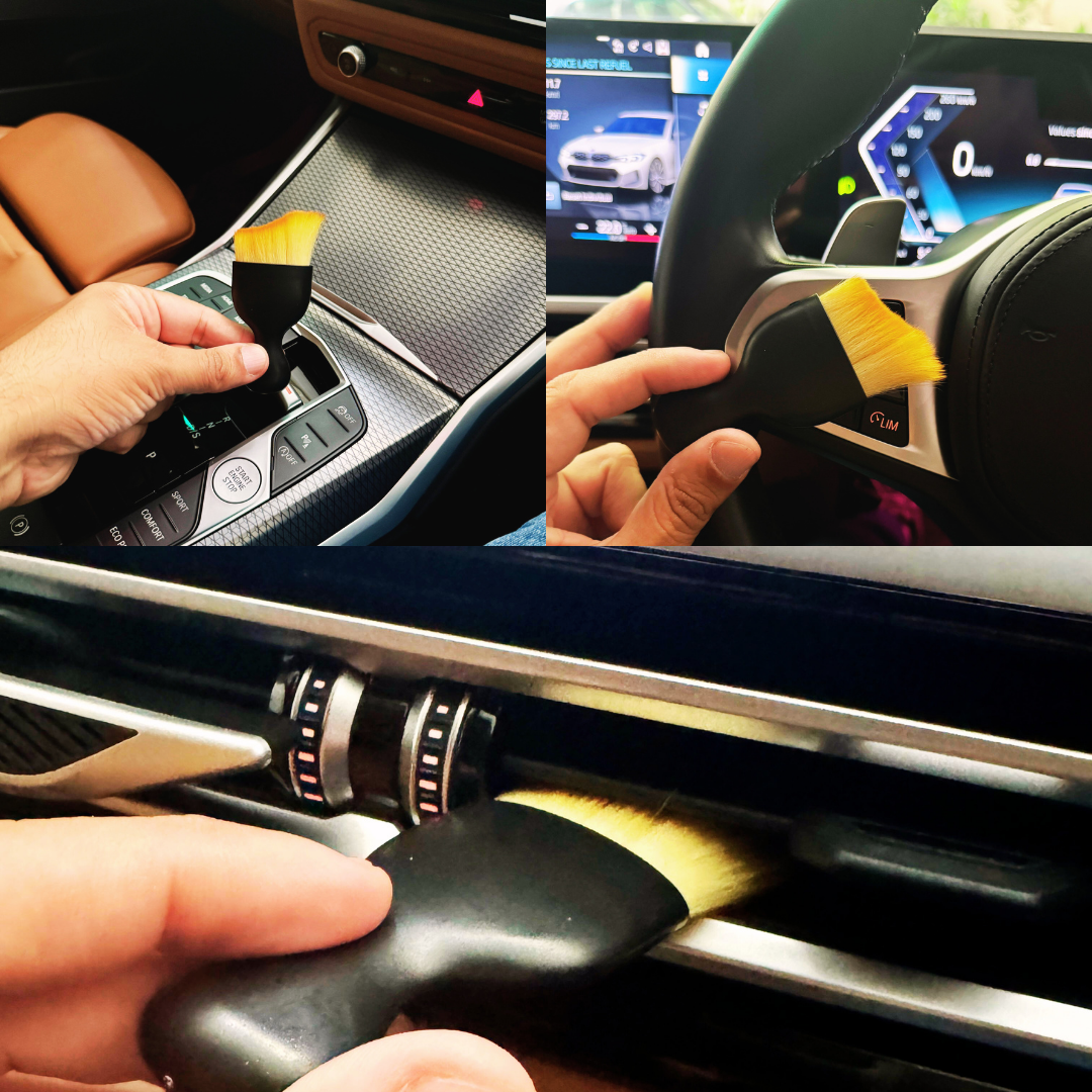 Car cleaning brush being used on car interior components.
