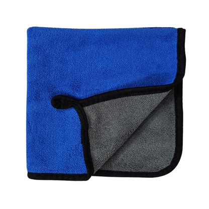 Folded towel with blue and gray sides on a white background