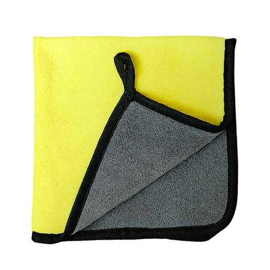 Foldable towel with yellow exterior and gray interior on a white background