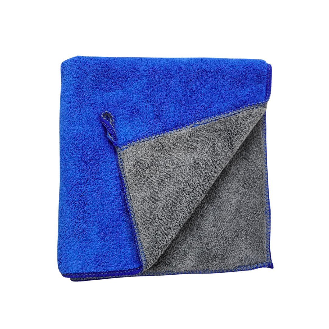 Folded blue and gray towel on a white background