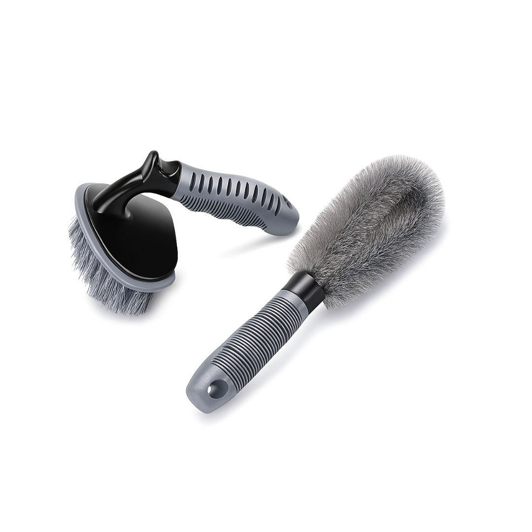 Two car cleaning brushes with gray bristles on a white background