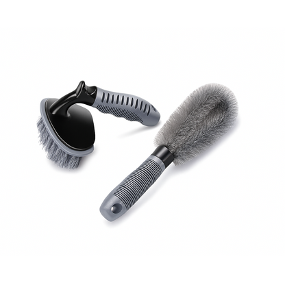Two car cleaning brushes with gray bristles on a white background