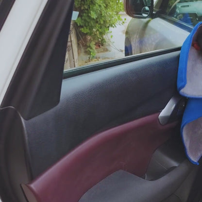 microfiber cloth cleaning the car interior